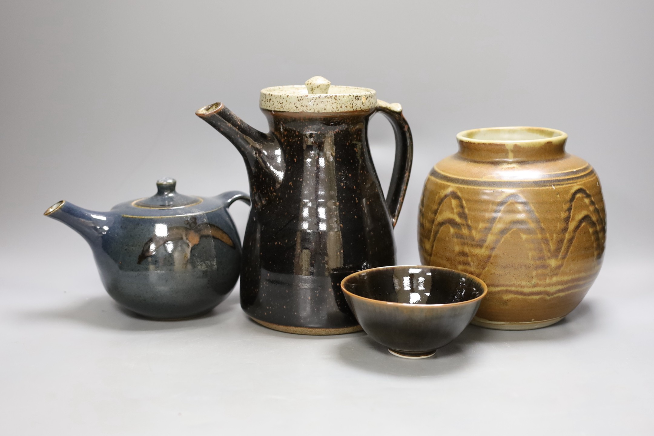 Geoffrey Whiting (1919-1988), a studio pottery teapot and coffee pot, a vase, together with an unattributed porcelain bowl. (4)-coffee pot 22cms high.